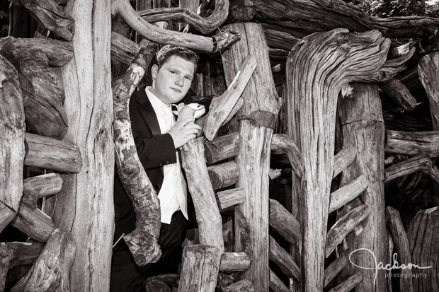 groom standing inside avam wooden sculpture