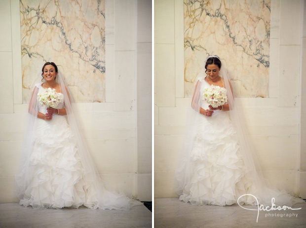 bride posing in front of marble