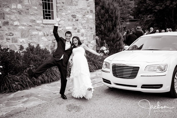 bride and groom by limo