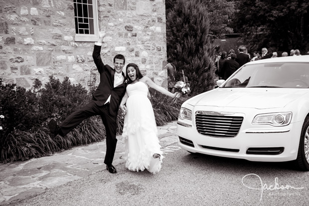bride and groom by limo
