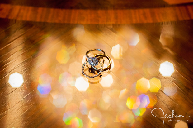 rings on reflective wood table