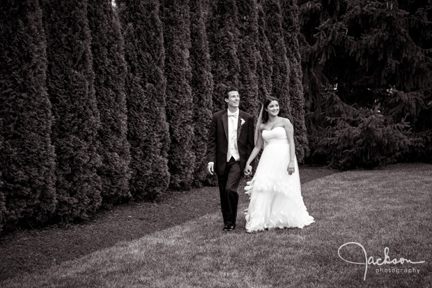 bride groom walking by trees