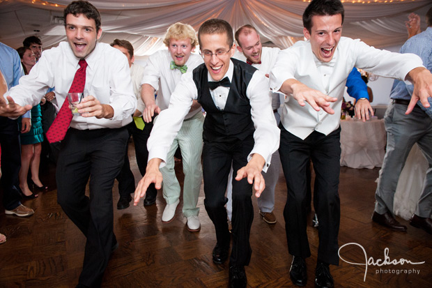 groom dancing with friends