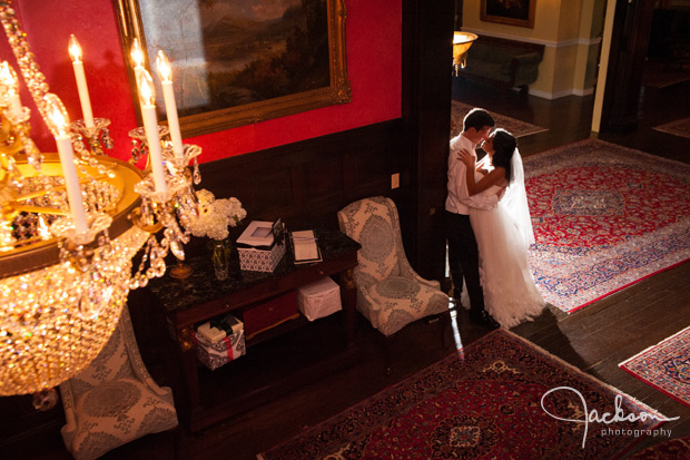 bride and groom leaning on doorway