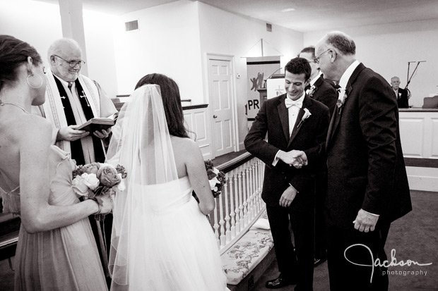 groom shaking dads hand at altar