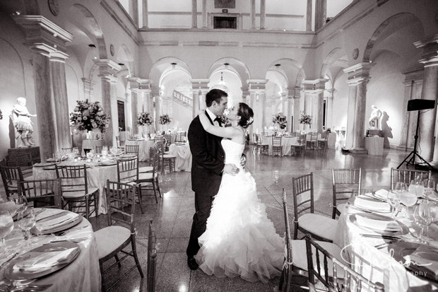 bride and groom among reception tables