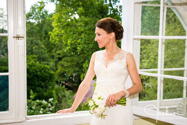 bride looking out suite window