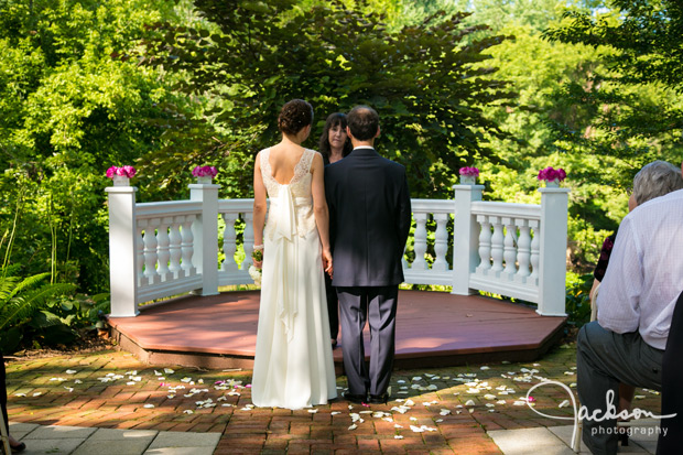 bride and groom at garden altar