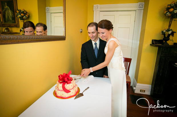 bride and groom cutting cake