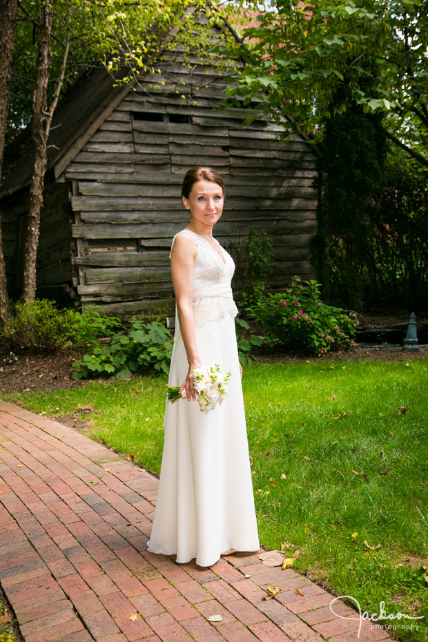 bride standing on brick walkway