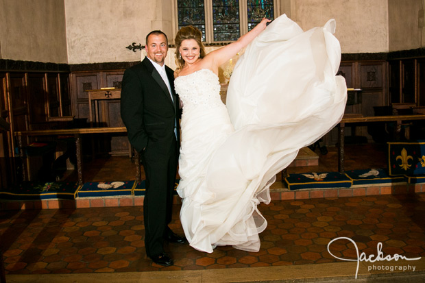 bride flinging her dress with groom