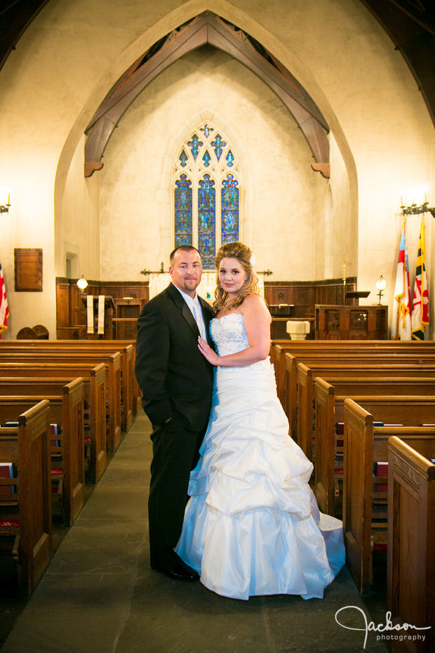 bride and groom formal in aisle of St. John's Episcopal