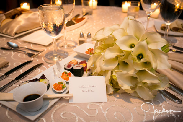 flowers and sushi on bridal table