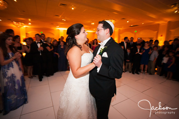 bride and groom dancing close