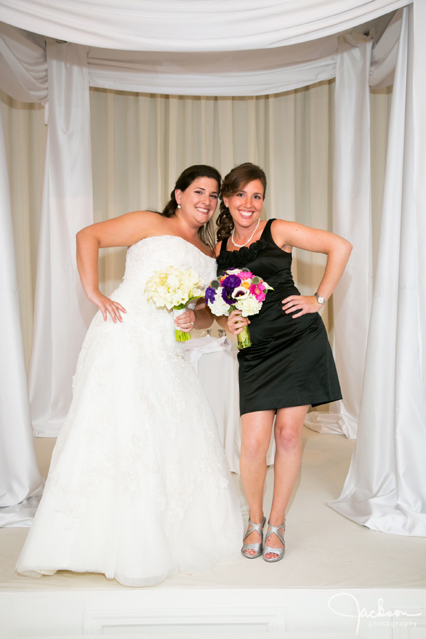 bride and maid of honor in black bridesmaid dress