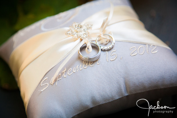 rings on embroidered pillow