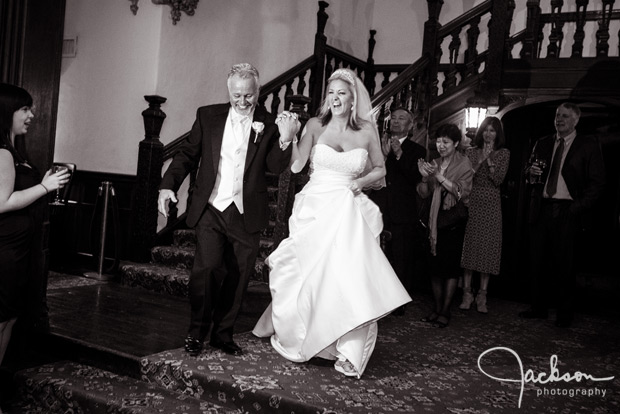 bride and groom entering reception