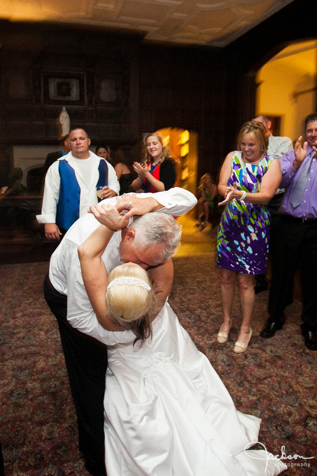 groom dipping bride on dancefloor