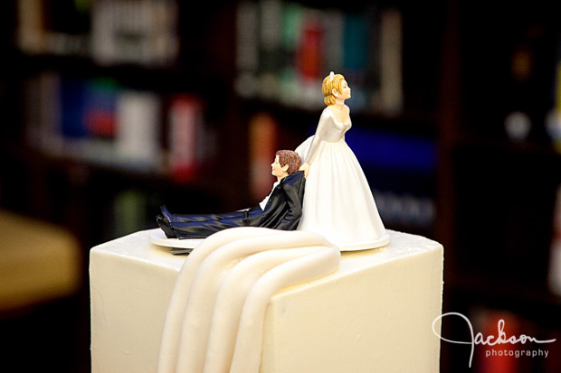 bride dragging groom cake topper