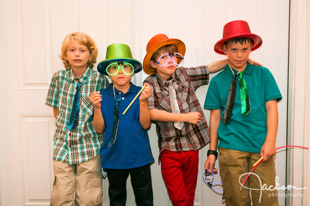 four boys dressed in neon