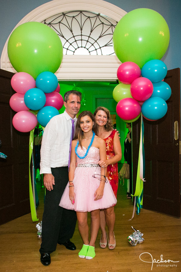 dad mom and daughter at the end of mitzvah reception