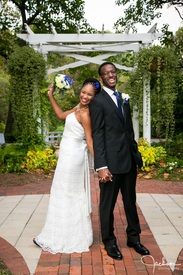 bride and groom leaning against each other