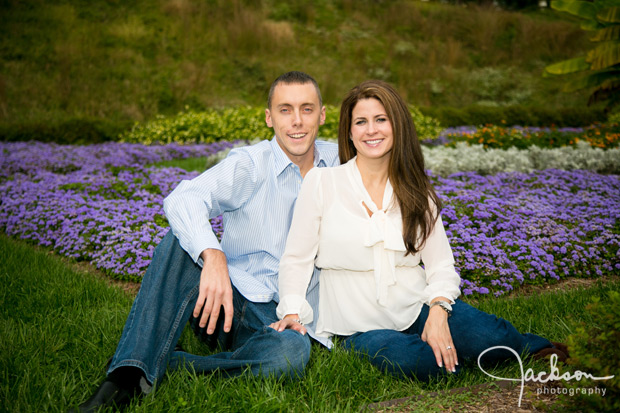couple sitting in grass of Hampton Mansion