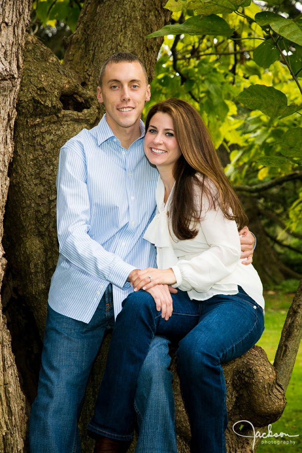 couple sitting on old tree