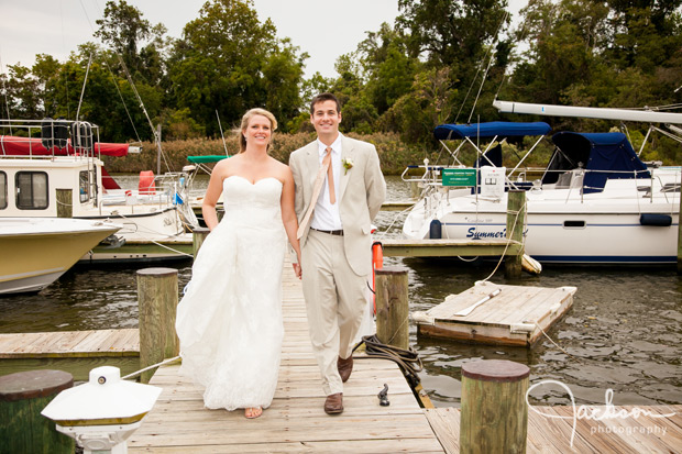 bride and groom walking on the pier