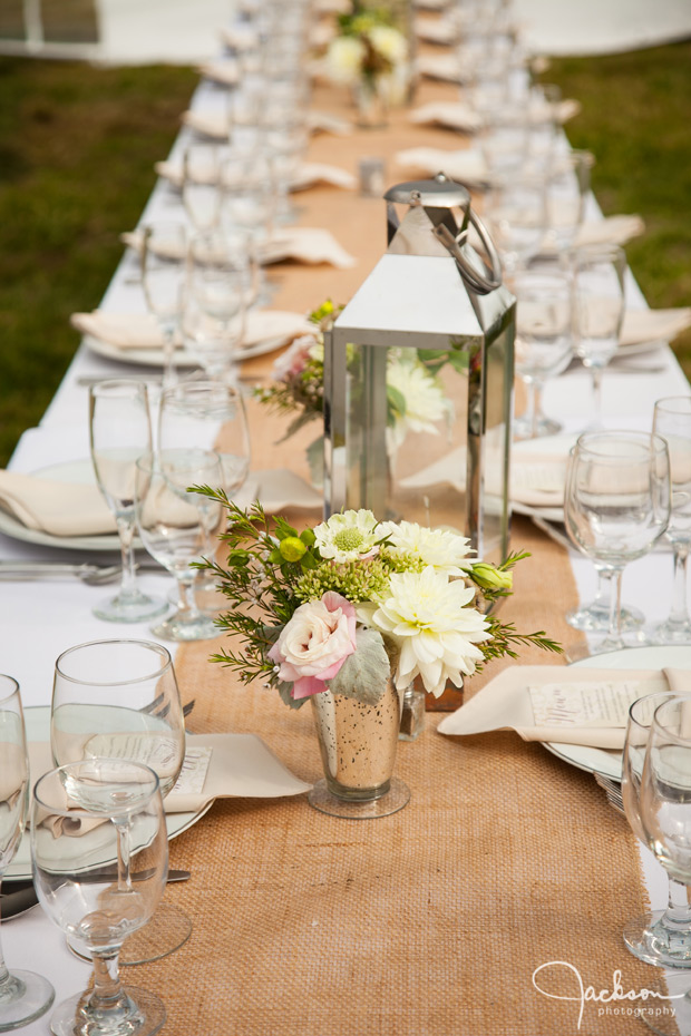 long tables with brown table cloth green flowers