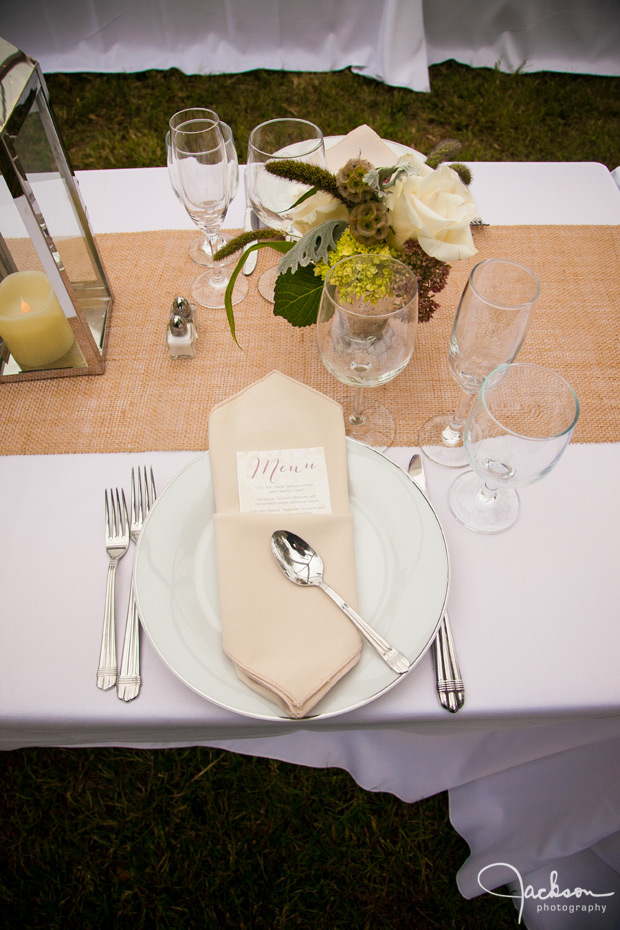 wedding plate set up with brown white and green