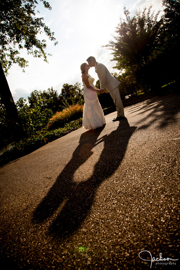 long shadow of bride and groom
