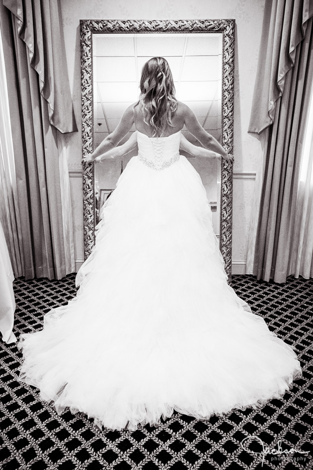 bride standing in front of mirror