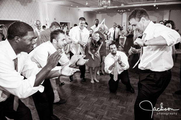 groom dancing with groomsmen