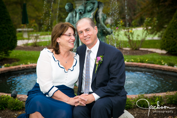 bride and groom sitting in garden