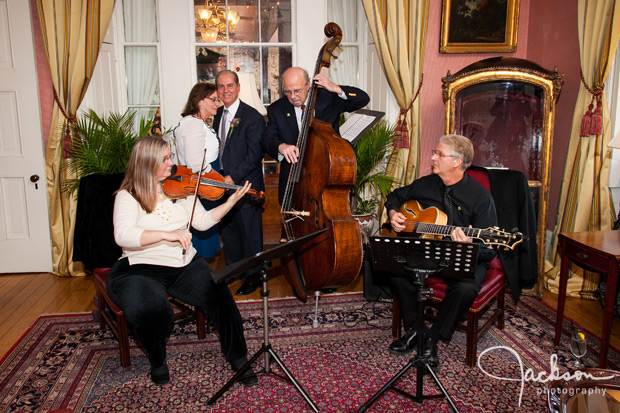 bride and groom with band