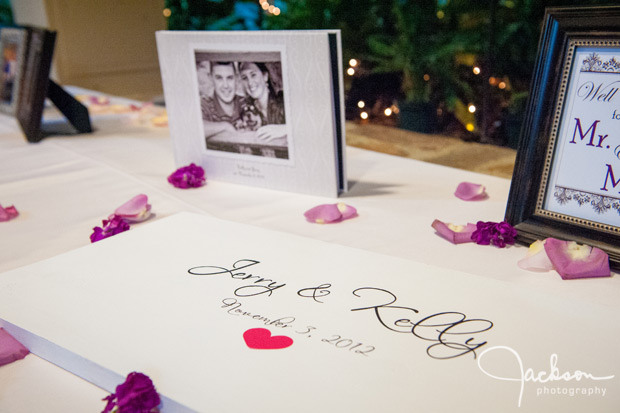 wedding sign in board with purple pink petals