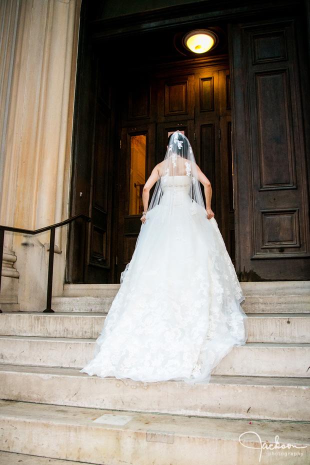 bride walking up the steps of the peabody