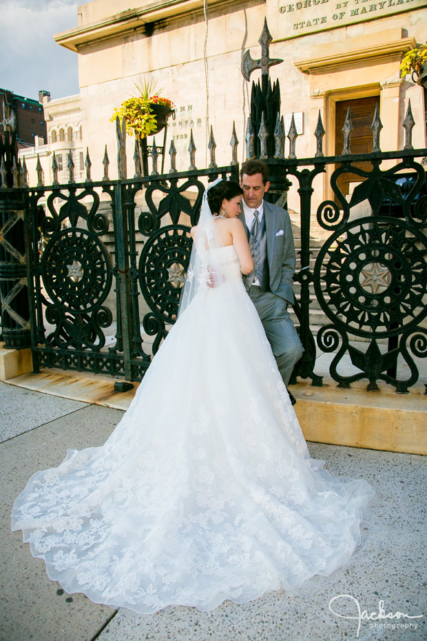bride and groom by iron washington monument gate