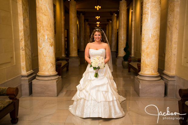 bride in columned hallway