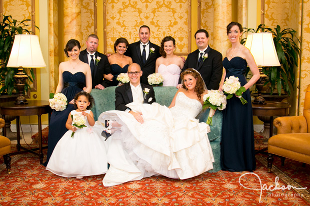 bridal party on a blue antique couch