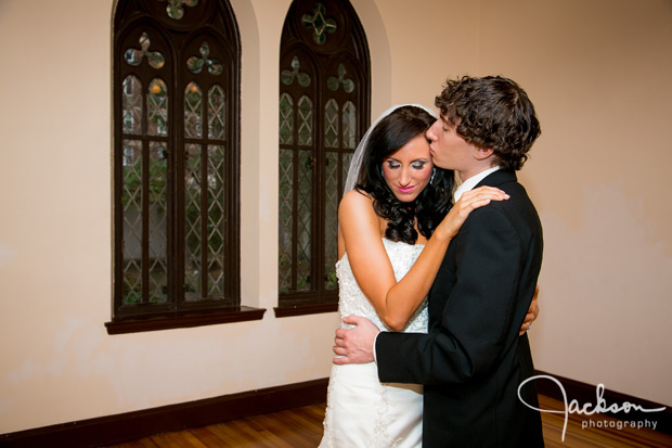 tender embrace with bride and groom