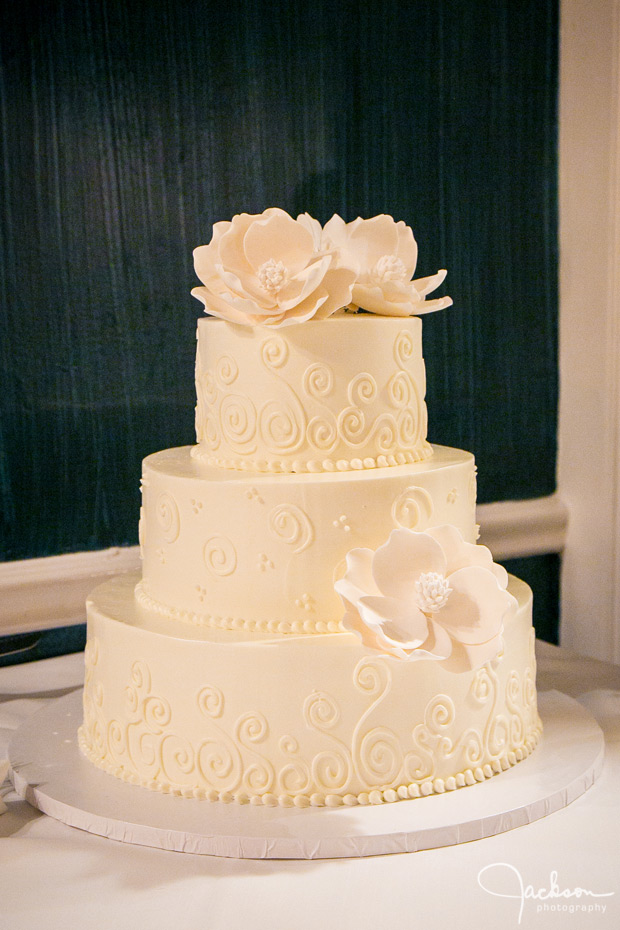 flowered tiered white wedding cake