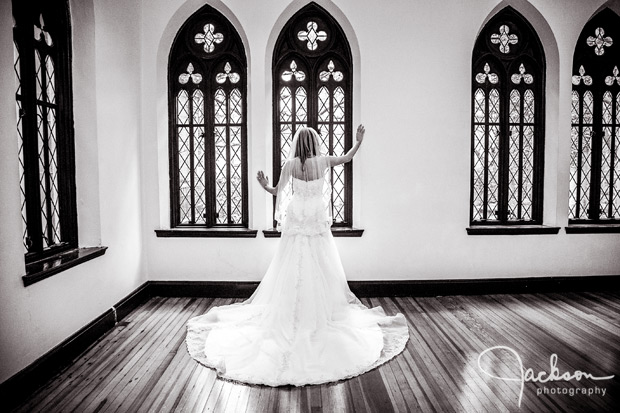 bride leaning on gothic window