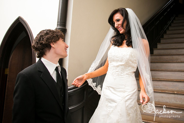 bride and groom first look in stairway